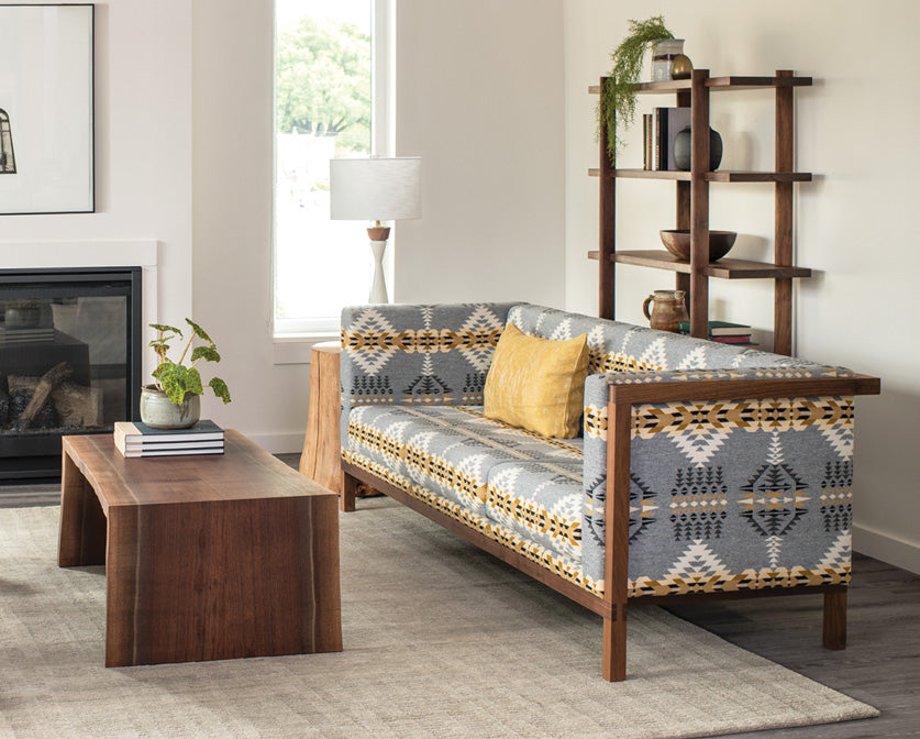 Celilo Sofa in Eastern Walnut in Pendleton wool with Miter Wrap Live-edge coffee table.