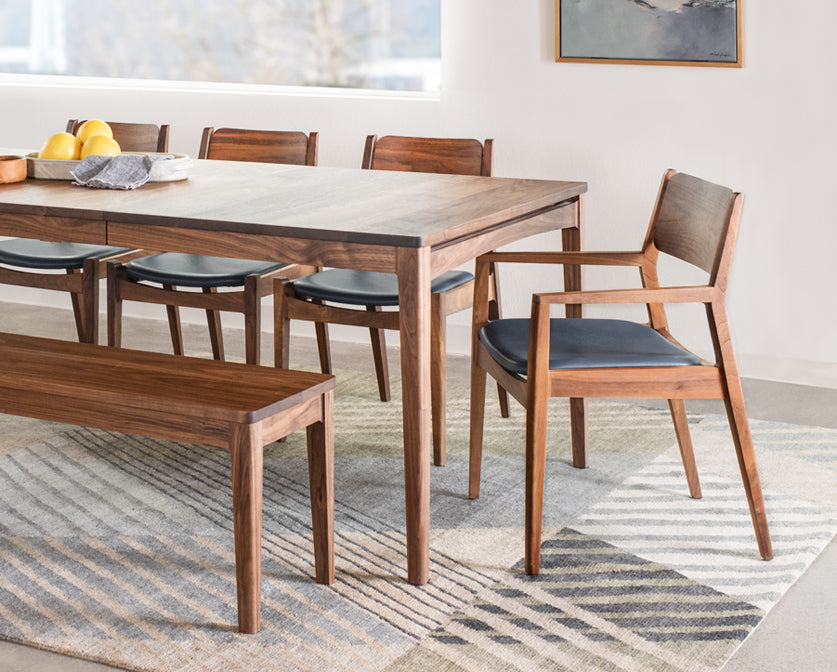 Whitman Arm Chair and Side Chairs in Eastern Walnut with leather upholstery.