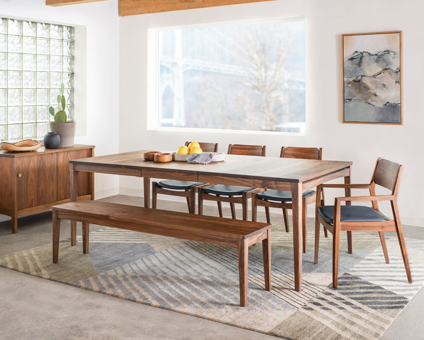 Whitman bench in Eastern Walnut shown with Whitman table, chairs, and sideboard.