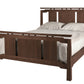 An Asian inspired bed with a dark Walnut wood frame and headboard, dressed in white bedding and two white pillows, shown against a plain white background.