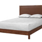 A wooden bed frame with a tall upholstered headboard in a warm brown tone, shown with white bedding and two pillows on a plain white background.