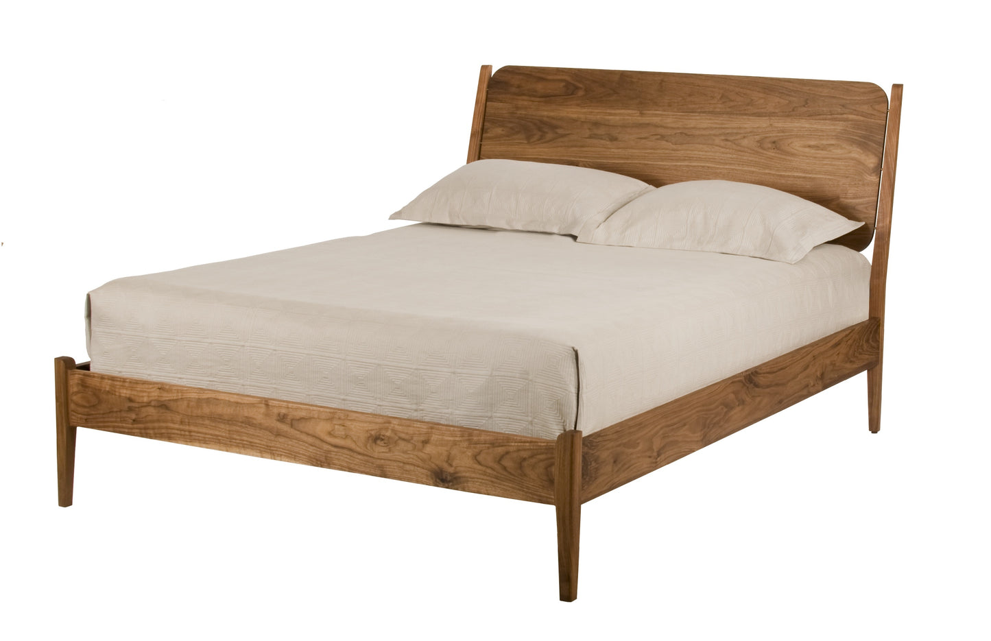 A mid-century modern Walnut wooden bed frame with a warm medium-brown finish, styled with a cream-colored mattress and two matching pillows, shown against a solid white background.
