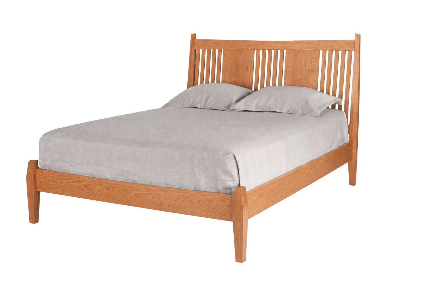 Contemporary Cherry wood bed with slats and panels on headboard. Featuring light toned bedding and matching pillows on white background. 