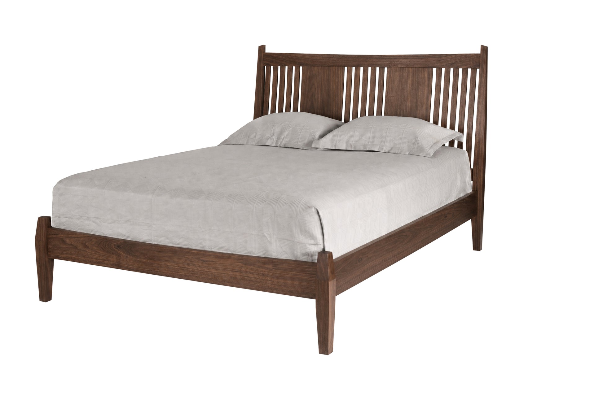 Contemporary Walnut wood bed with slats and panels on headboard. Featuring light toned bedding and matching pillows on white background. 