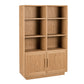 A tall wooden bookcase with six open shelves on the upper section and two cabinet doors on the lower section, shown on a plain white background.