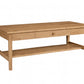 A light oak wood coffee table with two drawers on the top, an open lower shelf, and a natural wood grain finish, shown on a plain white background.