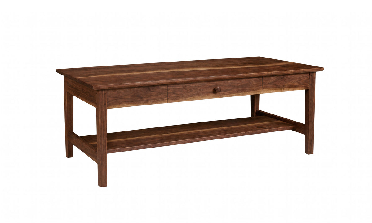 A dark brown wooden coffee table with a single drawer, a round metal pull handle, and an open lower shelf, shown on a plain white background.
