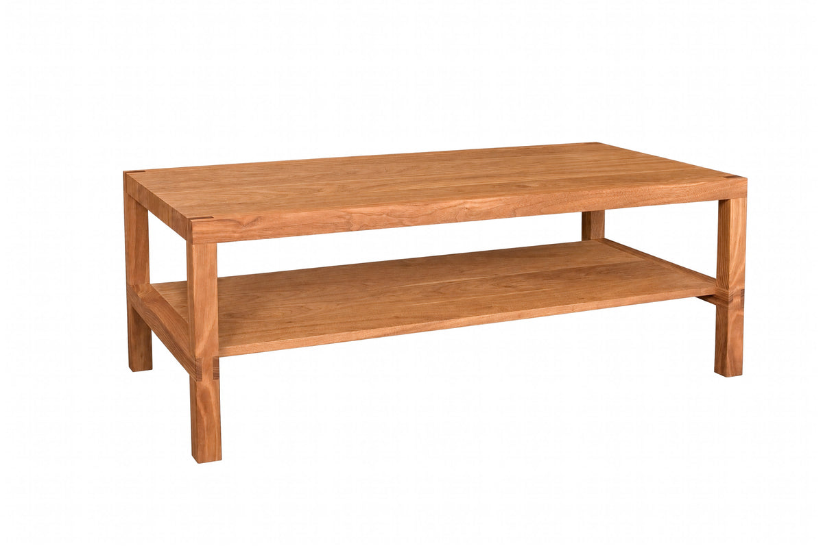 A rectangular wooden coffee table with a warm medium-brown finish, featuring a top surface and a lower shelf, isolated on a white background.