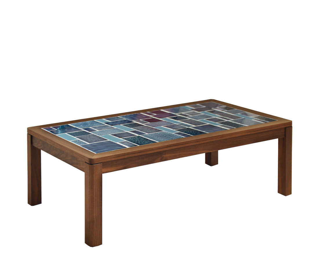 Coffee table with a mosaic tile top on a white background