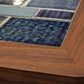 Close-up of a wooden frame with blue mosaic tiles