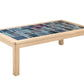 A rectangular wooden coffee table with a colorful mosaic tile top featuring shades of blue and teal, set against a plain white background.