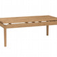 A light oak wood rectangular coffee table with a slatted lower rail and four straight legs, shown on a plain white background.