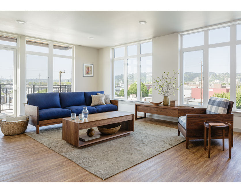 Clyde sofa in Eastern Walnut with Clyde Chair and Modern Coffee Table.