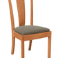 A wooden dining chair with a warm medium-brown wood frame and a textured gray upholstered seat cushion, shown against a plain white background.