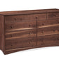 A wooden nine-drawer dresser with a dark Walnut finish and small round knobs, photographed on a plain white background.