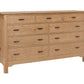 A light oak wood 9-drawer dresser with dark wood pull handles, shown from a three-quarter angle on a white background.