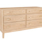 A contemporary wooden dresser with a Maple finish and brass pulls, shown from a three-quarter angle on a white background.