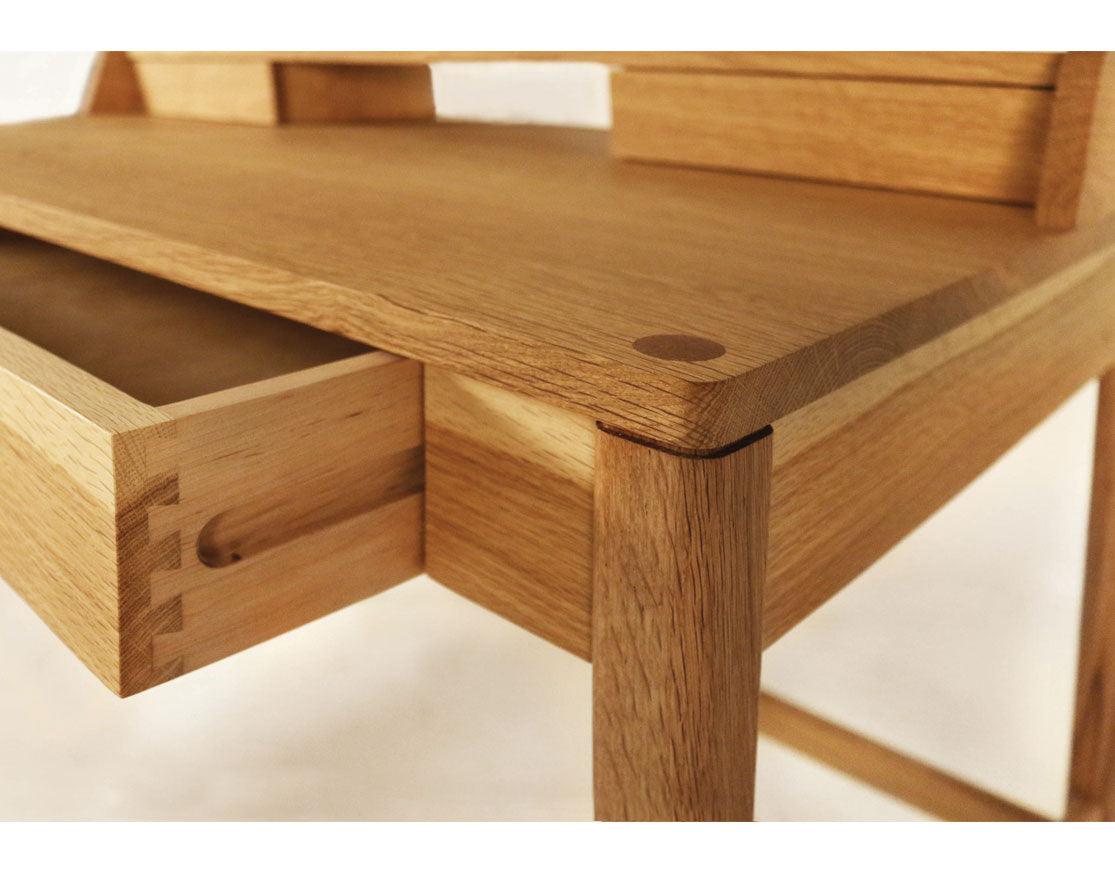 Drawer and desk top thru detail of Maud desk in Oregon White Oak