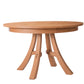 A round wooden dining table with a natural oak finish, featuring a thick oval tabletop and three curved splayed legs connected by a central stretcher, shown on a plain white background.