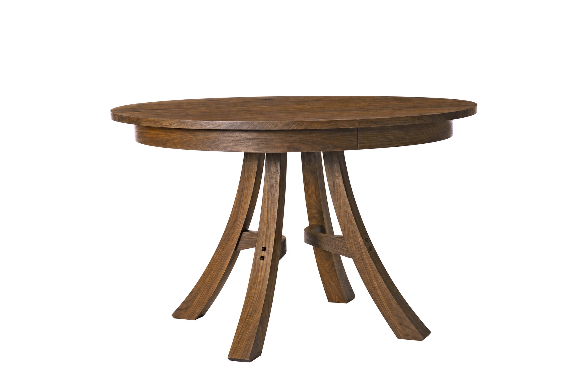 A round wooden dining table with a medium brown finish and curved legs, shown on a solid white background.