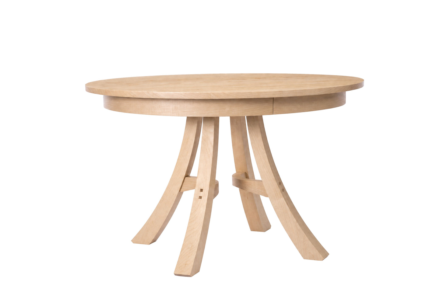 A round wooden dining table with a natural Maple finish, featuring a thick round tabletop and three curved legs joined by a central stretcher, shown on a solid white background.