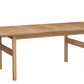 A light Oak wooden extendable dining table with a natural oak finish, shown from a three-quarter angle on a solid white background.