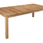 A rectangular wooden dining table with a natural oak finish, featuring four sturdy legs and a visible center drawer, shown on a solid white background.