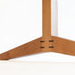Hayden leg detail in Cherry with Western Walnut details