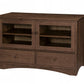 A medium Walnut wooden media console with two glass-front upper cabinets, two lower drawers, and curved front feet, shown on a plain white background.
