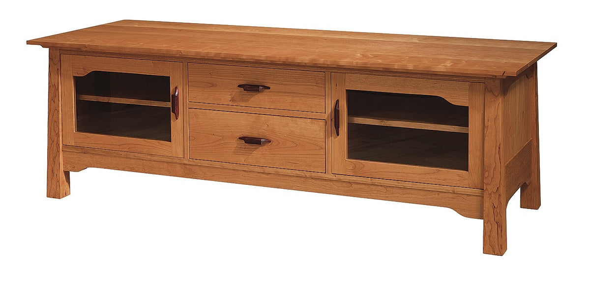 A wooden media console cabinet with a warm honey oak finish, featuring two central drawers with wood pulls and two side cabinets with glass doors, shown on a plain white background.