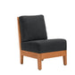 A modern accent chair with a dark charcoal gray fabric cushioned seat and backrest, supported by a light brown wooden frame, shown against a plain white background.