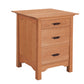 A three-drawer wooden nightstand with a warm honey-oak finish and dark wood drawer pulls, shown on a plain white background.