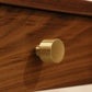 Brushed brass Maud knob on Eastern Walnut drawer front