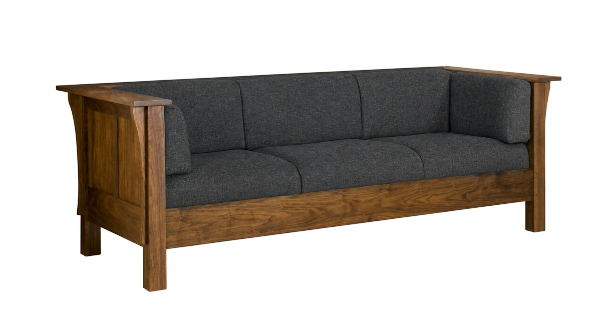 A three-seater wooden sofa with dark gray textured fabric cushions, shown from a three-quarter angle against a plain white background.